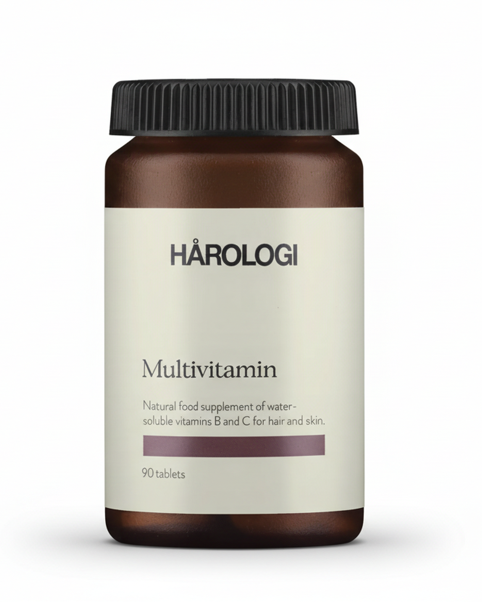 Brun plastboks med hvit etikette og sort kork 
Hårologi multivitamin 